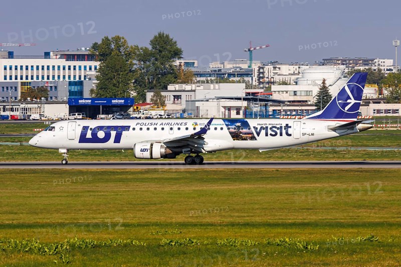An Embraer 195 aircraft of LOT Polish Airlines with the registration SP-LNI and the Visit North Moravia special livery at the airport in Warsaw, Poland, Europe