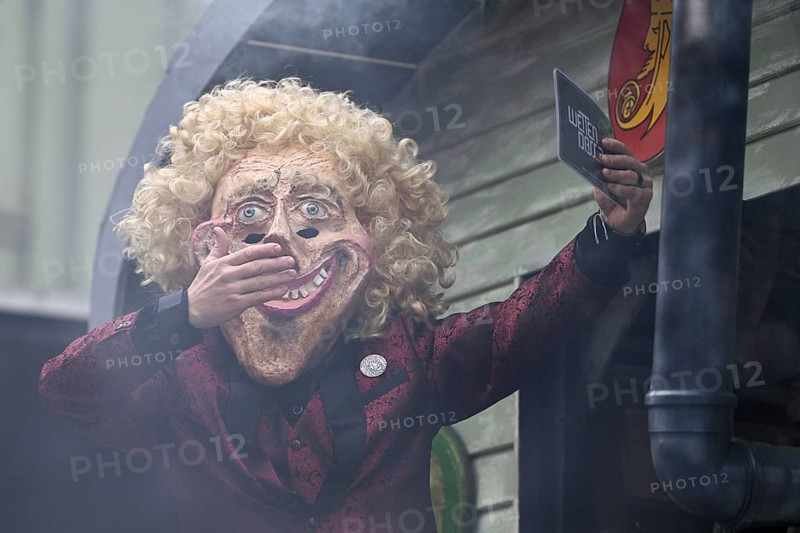 Person masked as Thomas Gottschalk at the carnival parade of the Wey guild on Rose Monday, Güdismäntig, Lucerne Carnival 2024, Lucerne, Switzerland, Europe