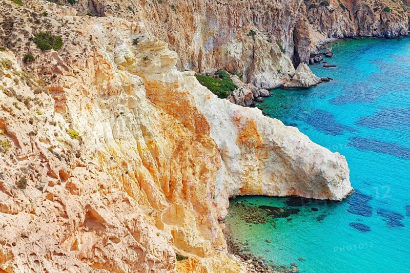 Multicoloured rock formations plunging into the sea, Firopotamos, Milos Island, Cyclades Islands, Greece, Europe