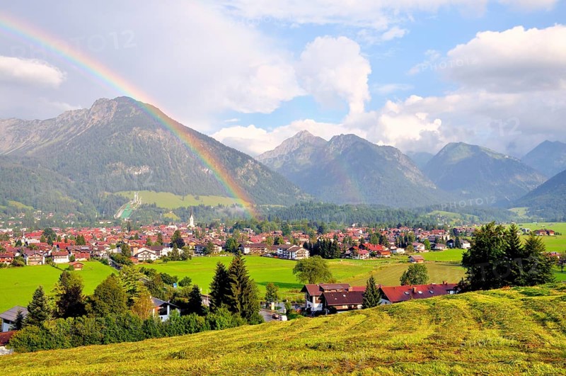 View over Oberstdorf with rainbow and Allgäu Alps, Oberallgäu, Bavaria, Germany, Europe