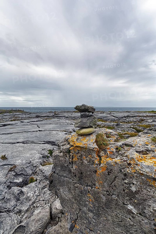Bizarrely shaped limestone slabs, stacks of stones on the coastline, limestone coast of the Burren, Murrooghtoohy viewpoint, County Clare, Wild Atlantic Way, Atlantic Ocean, Ireland, Europe