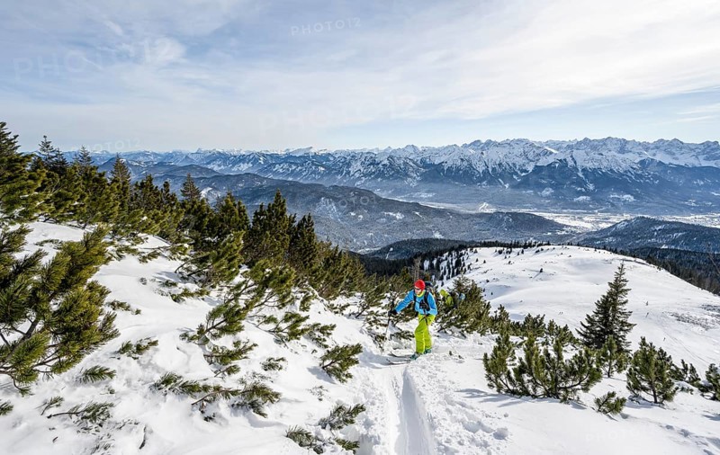 Ski tourers climbing Simetsberg, view of mountain panorama, Estergebirge, Bavarian Prealps, Bavaria Germany