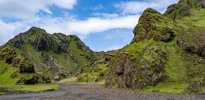Stream bed in a green moss-covered gorge, enchanted volcanic landscape, Pakgil, Iceland, Europe