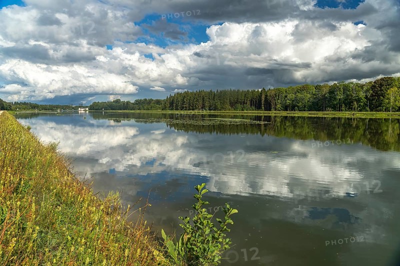Clouds reflected in the Danube reservoir Faimingen, Lauingen Donau, Bavaria, Germany, Europe