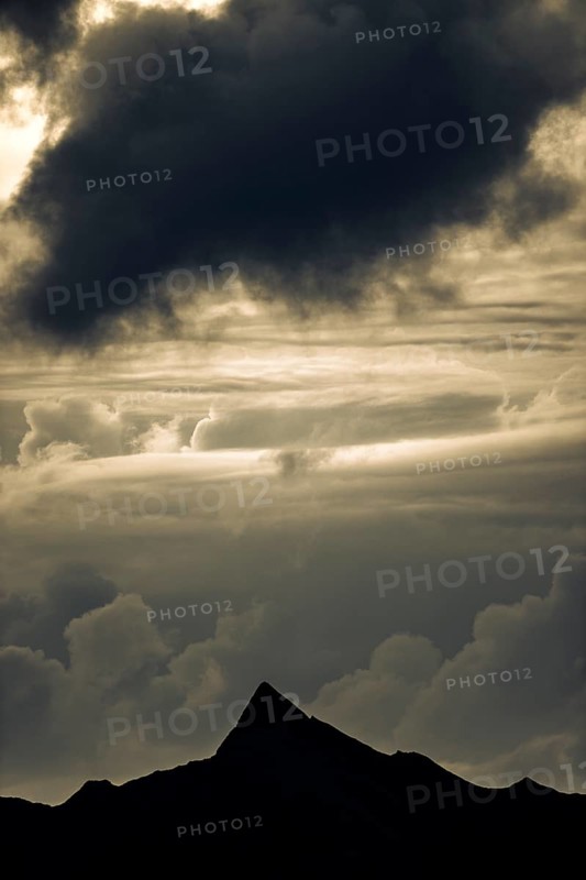 Summit in the morning light with dramatic clouds, Lech, Lechquellengebirge, Vorarlberg, Austria, Europe