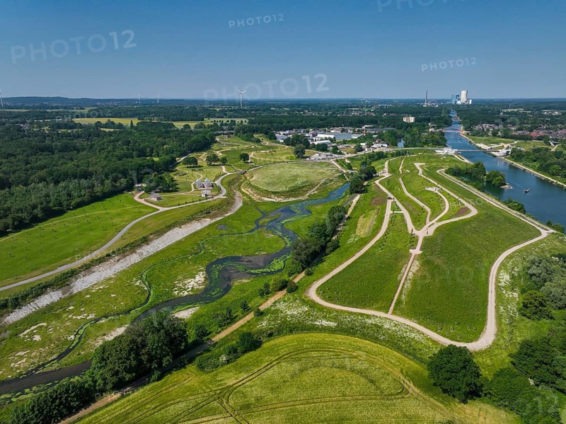 Castrop-Rauxel, Recklinghausen, North Rhine-Westphalia, Germany, EMSCHERLAND adventure park at the Emscher-RHK water crossroads. EMSCHERLAND, an approximately 30-hectare water and nature adventure park at the water crossroads of the Rhine-Herne Canal (right) and the renaturalised Emscher (centre) on the city boundary of Recklinghausen and Castrop-Rauxel. The ecological focus at the confluence of the Suderwicher Bach (left) and Emscher (centre) will also be a future garden for the International Garden Exhibition 2027. Before the renaturation, the Emscher river system was an open, above-ground wastewater channel, combined sewer with surface water and wastewater. Where the Emscher, the Suderwicher Bach and the Rhine-Herne Canal meet, an inter-municipal adventure park has been created in recent years on an area of around 30 hectares. The park's facilities include a water playground, a water learning centre, a perennial garden, a beekeeper's house, a meadow orchard, Europe