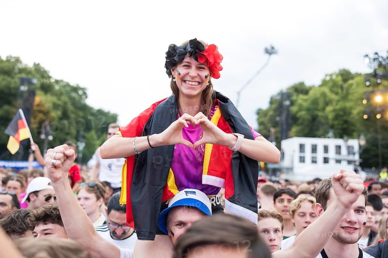 Celinda forms a heart with her hands in the fan zone at the Brandenburg Tor during the round of 16 match between Germany and Denmark at the European Football Championship, Berlin, 29 June 2024