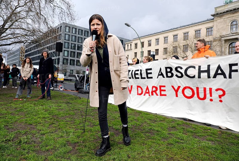 Luisa Neubauer speaks during a demonstration by Fridays for Future for compliance with climate targets and the resignation of Transport Minister Volker Wissing at the Federal Ministry of Transport, Berlin, 31 March 2023