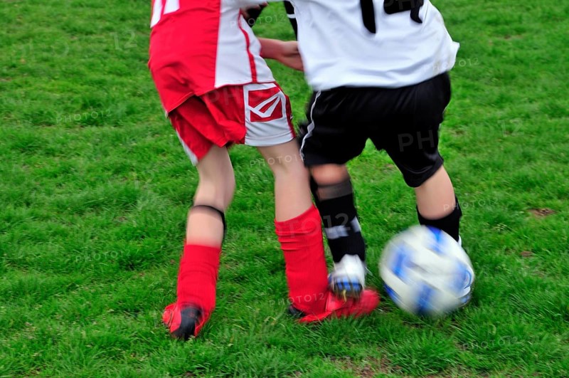 Foul, kick on the foot, participant in an E-1 junior football tournament, Baden-Württemberg, Germany, Europe