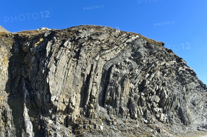Folded rock layer, geological outcrop on the Furka Pass, Obergoms, Valais, Switzerland, Europe