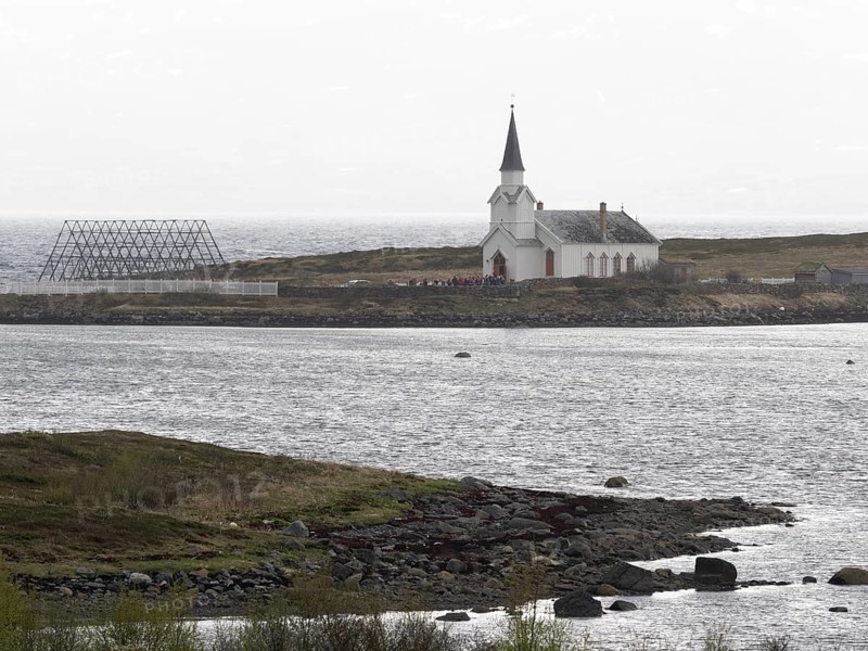 Nesseby town church, with congregation standing outside on Whit Sunday, May, Varanger Fjord, Norway, Europe