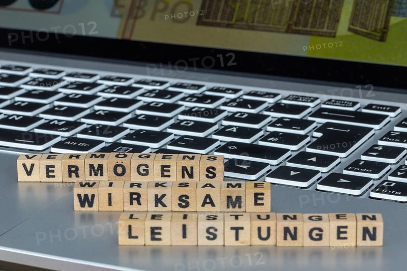 Symbol image of capital-forming benefits Germany : The word VERMÖGENSWIRKSAME LEISTUNGEN (capital-forming benefits) is written on a laptop with letter cubes