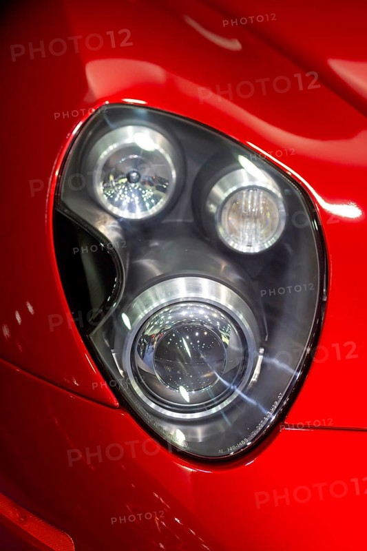 Detroit, Michigan USA - 10 January 2025 - The headlights of an Alfa Romeo in The Gallery, a luxury vehicle exhibition space at the 2025 Detroit Auto Show