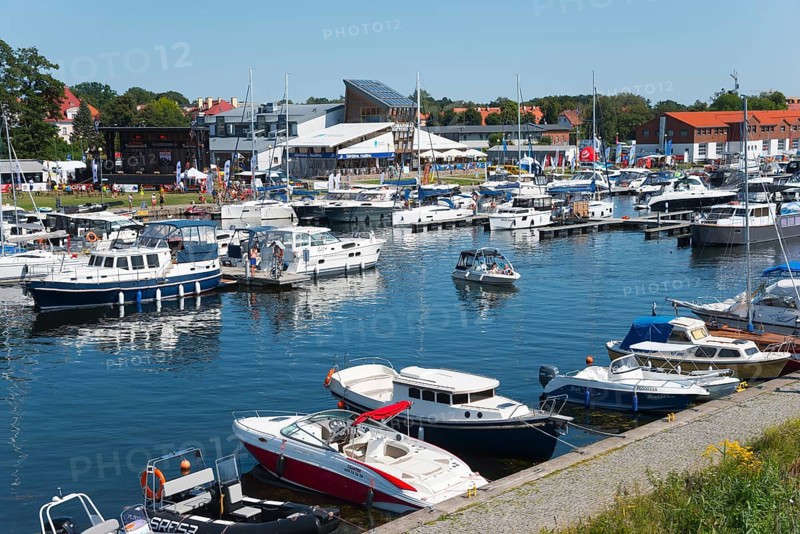A lively marina with many boats and surrounding houses, Gizycko, Warminsko-Mazurskie, Warminsko-Mazurskie, Poland, Europe