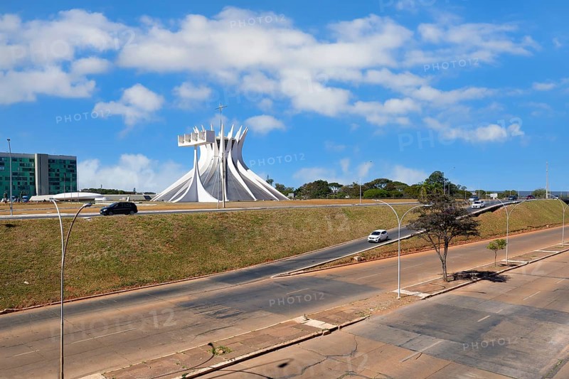 Roman Cathedral of Brasilia or Metropolitan Cathedral of Our Lady of Aparecida, designed by Oscar Niemeyer viewed from an urban highway, Brasília, World Heritage Site, Brasilia, Federal district, Brazil, South America