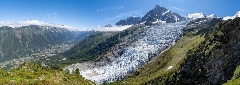 Panorama, mountain landscape with glacier Glacier des Bossons and summit of the Aiguille du Midi, view into the valley with the village of Chamonix, Chamonix, Haute-Savoie, France, Europe