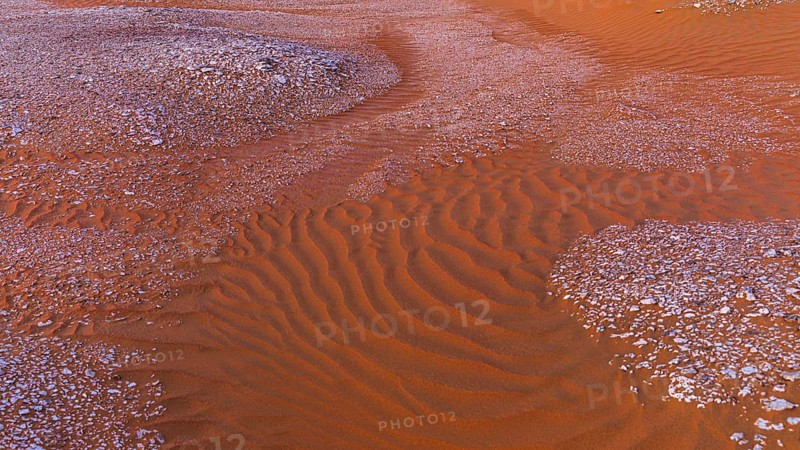 Gravel surrounded by wind-blown sand structures, Huqf stone desert, Arabian Peninsula, Sultanate of Oman