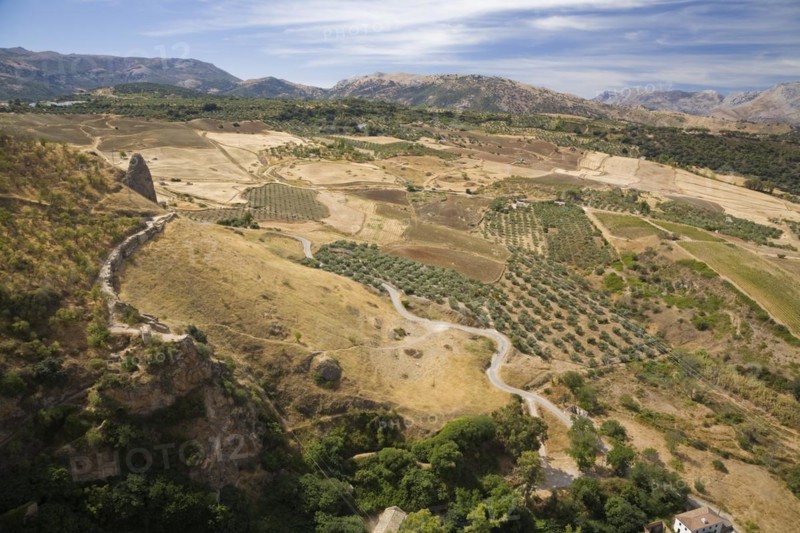 High angle view of valley with agricultural lands and mountains in the background in Ronda, Spain, Europe