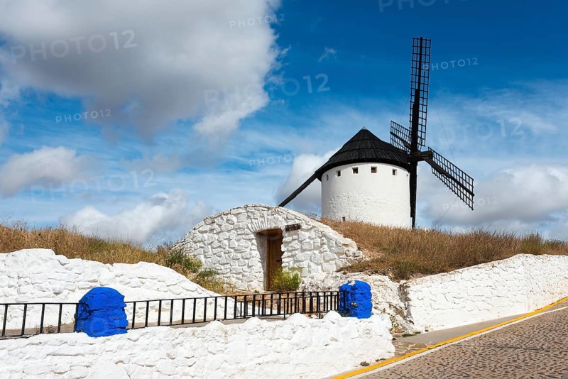 White windmill on a hill with blue sky in the background, Cueva de Mambrino, Craft Museum, Molino Infanto, Campo de Criptana, Ciudad Real province, Castilla-La Mancha, Route of Don Quixote, Spain, Europe