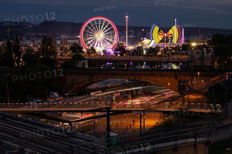 Stuttgarter Volksfest, Cannstatter Wasen Stuttgart 2024 Baden-Württemberg, Germany. In the background the Rotenberg with the burial chapel on the Württemberg and the Swabian car manufacturer with the star