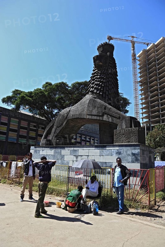 Addis Ababa, street scene in the city centre, statue of a lion in front of the National Theatre, Ethiopia, Africa