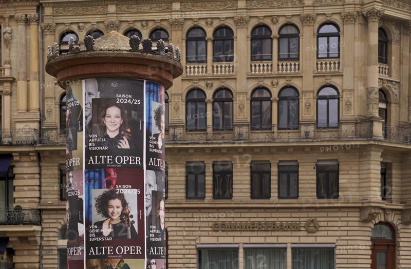 Historic advertising pillar, posters, programme for Alte Oper 2024-2025, Commerzbank, lettering, logo, Opernplatz, Frankfurt am Main, Hesse, Germany, Europe