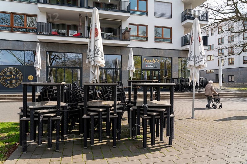 Closed gastronomy, during the Corona condition lockdown in April 2021, outdoor catering, stacked tables and chairs, on the Ruhr promenade, Am Stadthafen Ruhrbahnia, Mülheim an der Ruhr, North Rhine-Westphalia, Germany, Europe