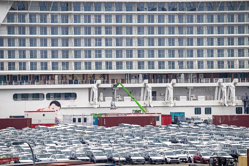Parking space for import vehicles, hundreds of Hyundai Ioniq, electric cars, waiting for onward transport, cruise ship World Dream, Manara, at the EUROGATE container terminal in the overseas port of Bremerhaven, Lower Saxony, Germany, Europe