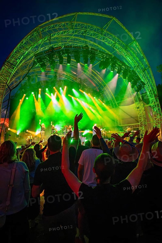At night at the open-air concert with green lighting, crowd and stage, Klostersommer, Calw Hirsau, Black Forest, Germany, Europe