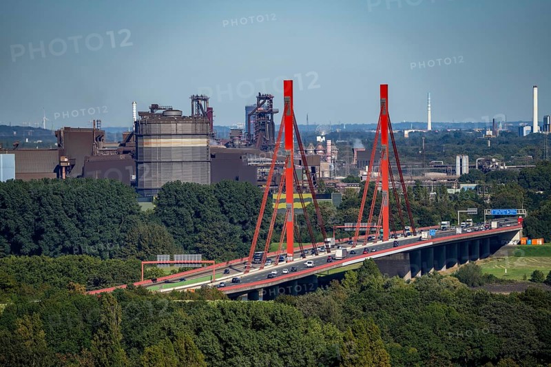 A42 motorway bridge over the Rhine at Duisburg Beeckerwerth, Thyssenkrupp Steel steelworks, blast furnaces, Duisburg, North Rhine-Westphalia, Germany, Europe