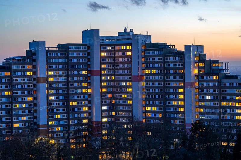 High-rise buildings in the Bensberg residential park, Bergisch-Gladbach, 18-storey housing estate with over 900 flats spread over 7 building complexes, dusk, illuminated windows, North Rhine-Westphalia, Germany, Europe