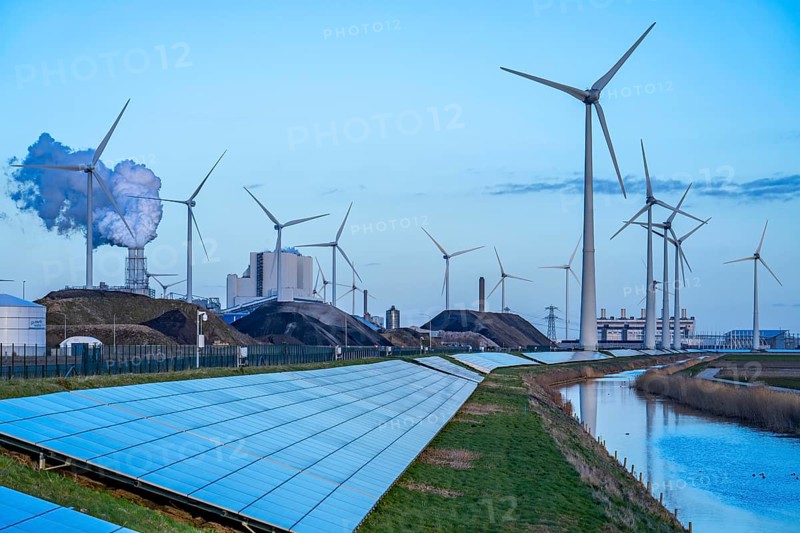 Solar park on the Slaperdijk dyke near the Eemshaven, test project, 17, 000 solar modules were installed over a good 5 kilometres, the Netherlands has over 22, 000 kilometres of dyke line, here it is being tested whether such an installation is successful and can be expanded, wind farm, behind the RWE coal-fired power plant Eemshavencentrale Groningen, Netherlands