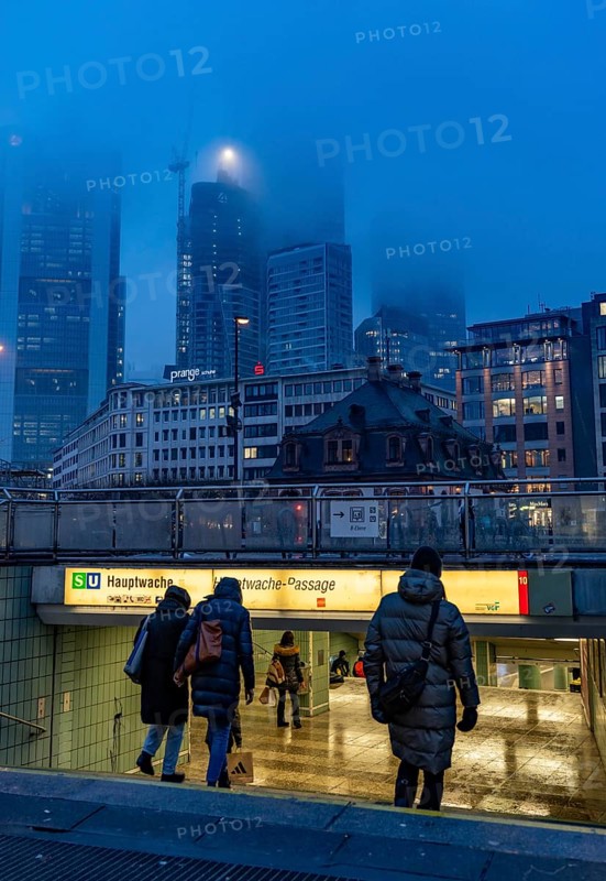 Rainy weather, freezing rain, entrance to Hauptwache underground station, high-rise skyline in clouds, passers-by hurrying through the damp, icy weather, Frankfurt am Main, Hesse, Germany, Europe