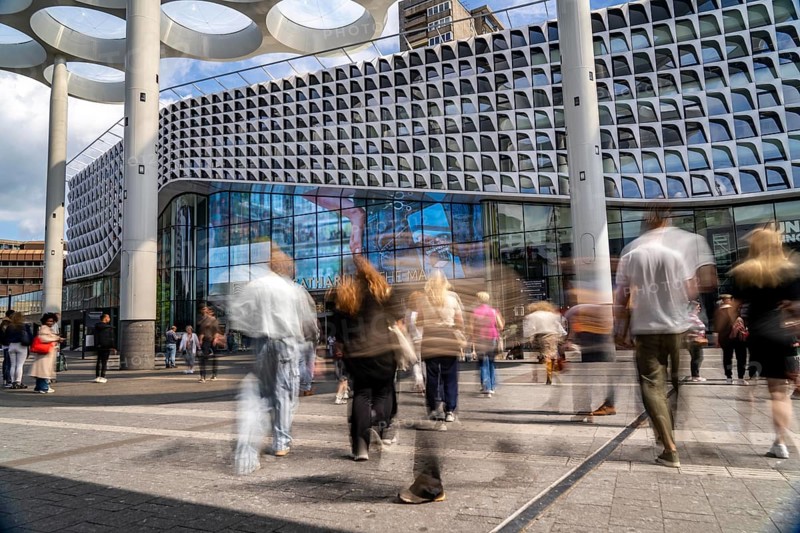 Station forecourt of Utrecht Centraal station, people on their way to and from the station, Hoog Catharijne shopping centre, Netherlands