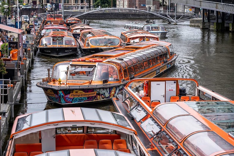 Canal cruises, pier of Lovers Canal Cruises, at Amsterdam Centraal station, Amsterdam Netherlands