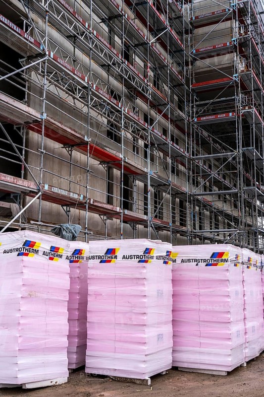 New construction, shell construction, thermal insulation, material waiting to be installed on the façade, energy insulation