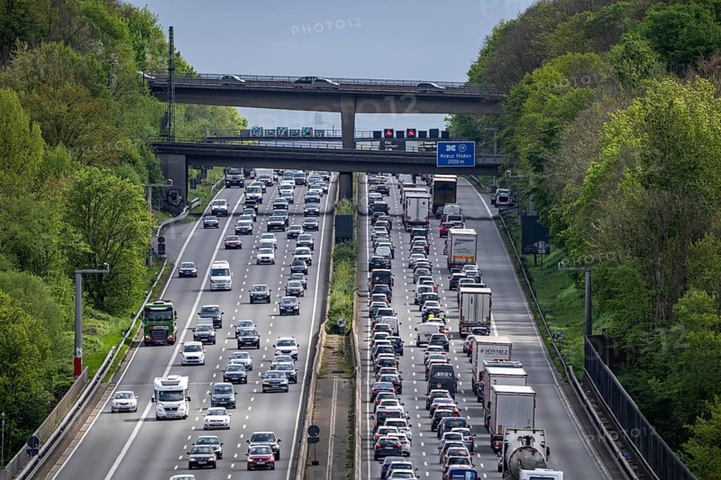 The A3 motorway, heavy traffic on 8 lanes, including the temporarily open hard shoulder, in front of the Hilden motorway junction, looking south, near Erkrath, North Rhine-Westphalia, Germany, Europe
