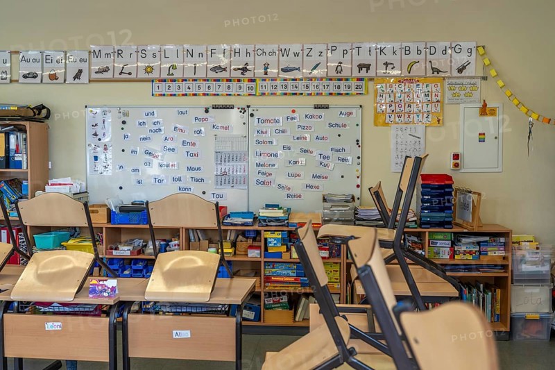 Classroom of a fourth grade, after school, the building is older but in good condition, language learning, grammar, words, language, vocabulary