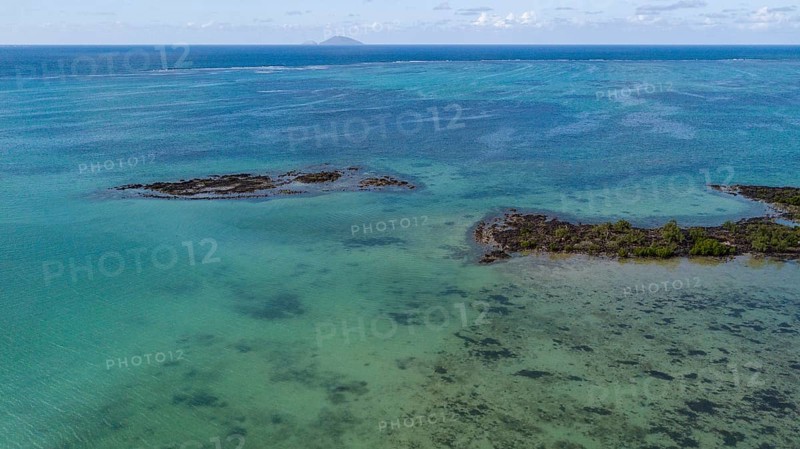 Bird's eye view of aerial view of lagoon at Cap Malheureux, reef edge in the background, Mauritius, Africa
