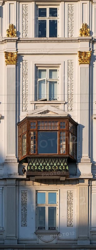 Neoclassical house façade with partially gilded stucco decorations and a projecting bay window, Nørreport, Copenhagen, Denmark, Europe