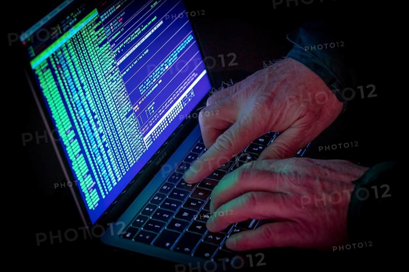 Symbolic image cyber attack, computer crime, cybercrime, computer hackers attack a network, computer, IT infrastructure