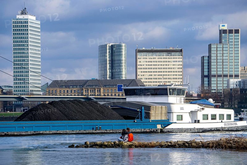 The Rhine near Düsseldorf, cargo ship, coal freighter, skyline, Rhine knee bridge, North Rhine-Westphalia, Germany, Europe