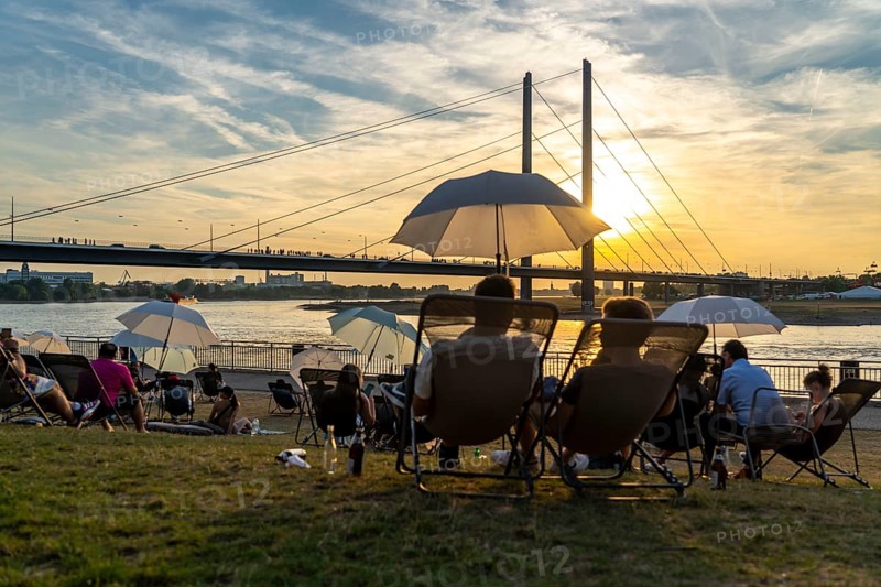 The city beach on the Rhine near Düsseldorf, riverside promenade, by the Rheinkniebrücke bridge, Sunset Chillout, North Rhine-Westphalia