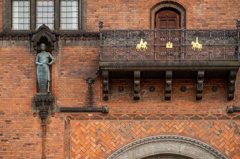 Brick façade with knight sculpture and balcony, town hall in the National Romantic style by Martin Nyrop, Town Hall Square, Rathausplatz or Rådhuspladsen, Copenhagen, Denmark, Europe