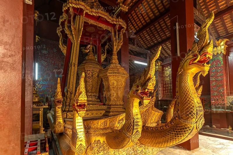 Nagas on the hearse in the funeral hall of the Buddhist temple Wat Xieng Thong in Luang Prabang, Laos, Asia