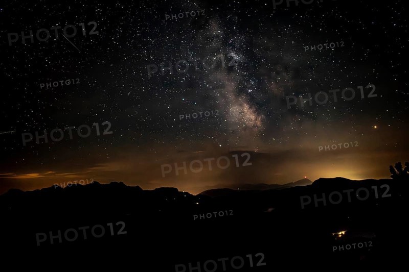 Starry sky with the Milky Way over the Chiemgau Alps, view towards Loferer Steinberge and Kitzbühler Horn, Bavaria, Germany, Europe