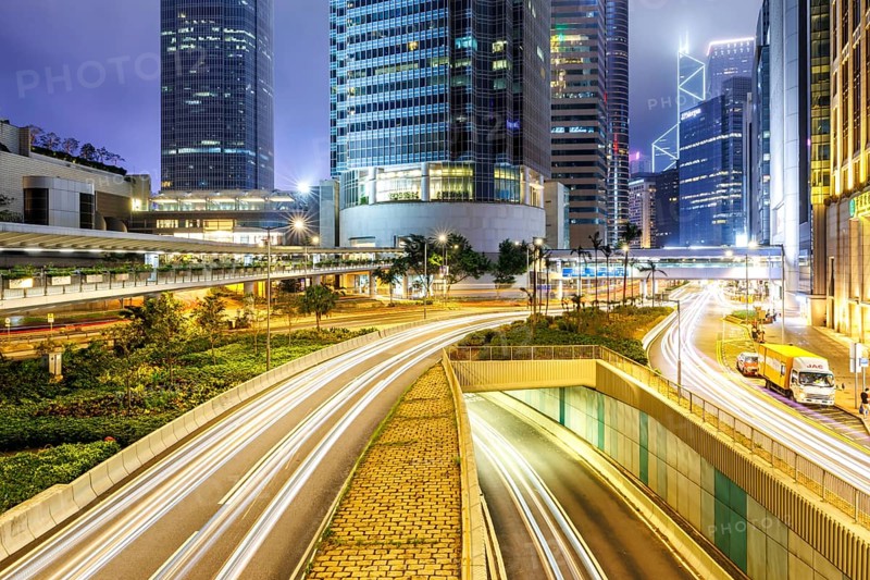Hong Kong at night traffic with streets and skyscrapers in Hong Kong, China, Asia
