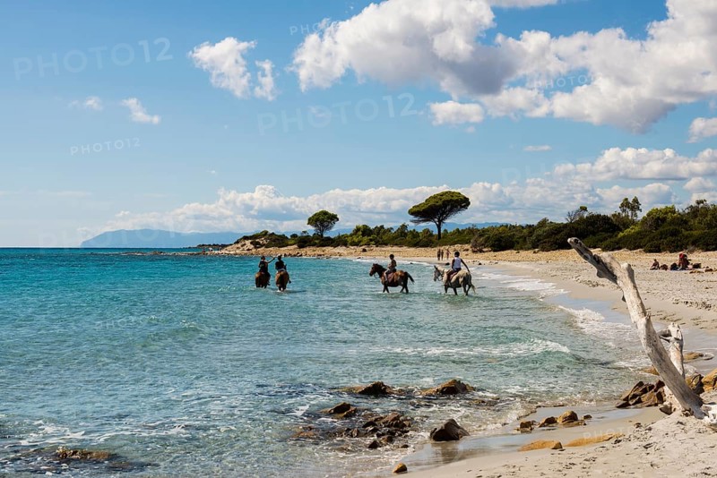 Lonely beach and riders, Spiaggia di Biderosa, Riserva Biderosa nature reserve, Orosei, Nuoro province, east coast, Sardinia, Italy, Europe