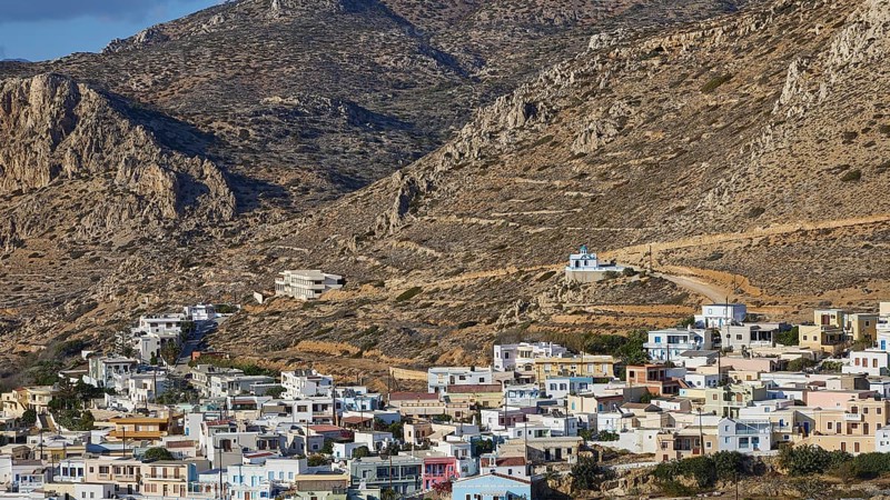 Picturesque village with colourful houses on a mountainside, Arkasa, west coast, Karpathos, Dodecanese, Greek Islands, Greece, Europe