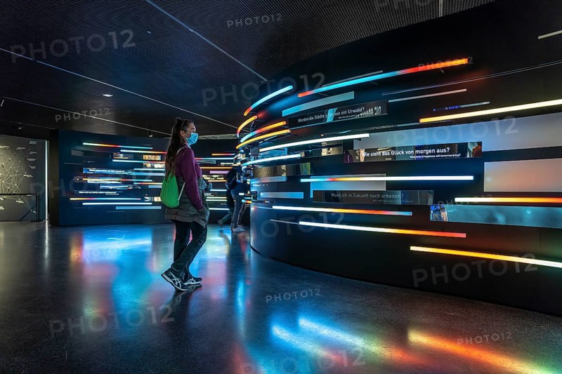Visitor with mask in the exhibition in the interior of the Museum for Future Issues Futurium in Berlin, Germany, Europe